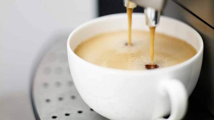 espresso pouring from coffee machine.jpg
